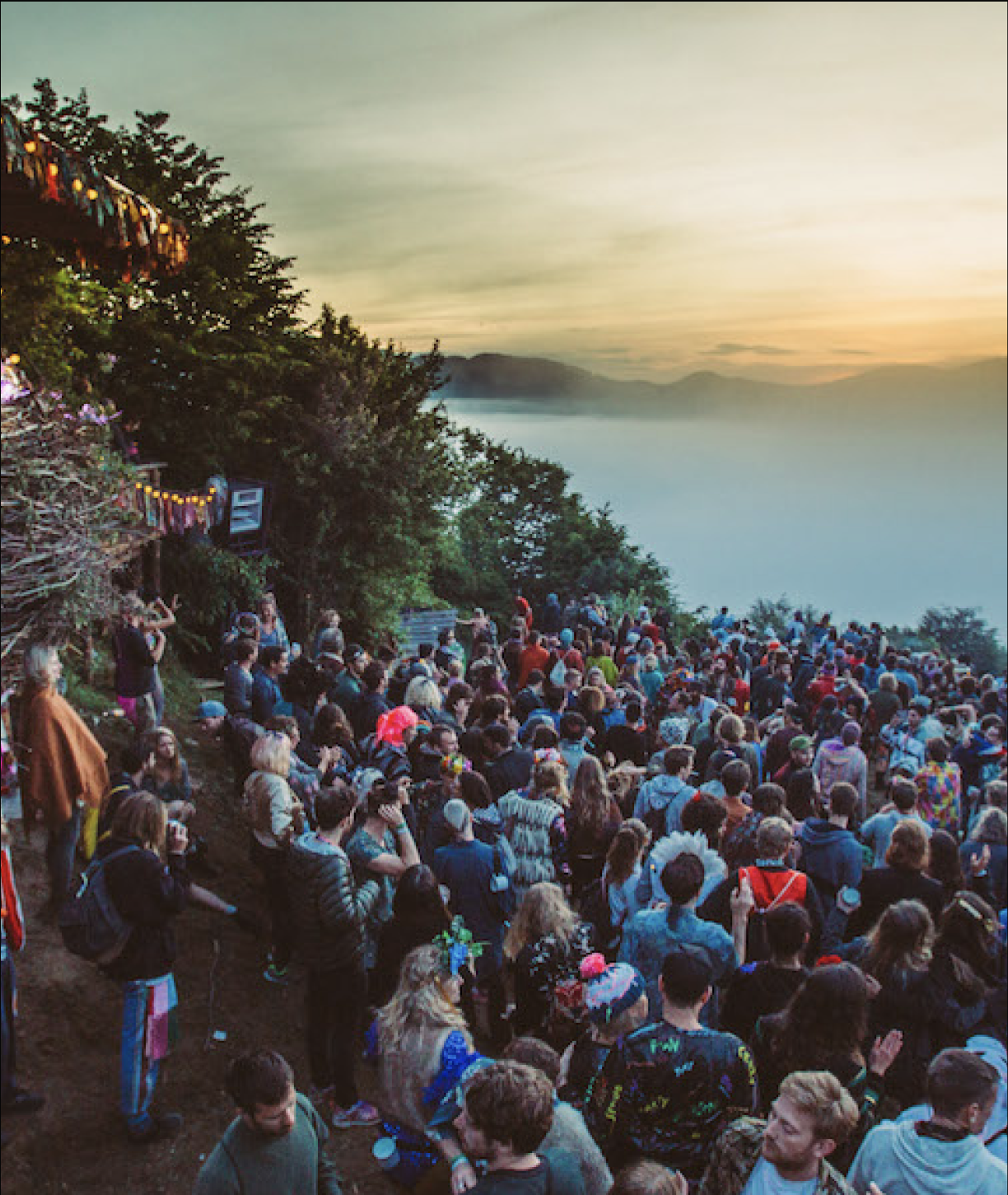 A festival crowd on a hilltop